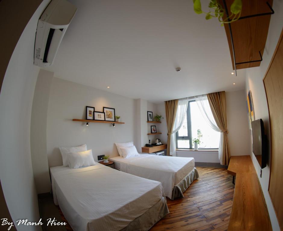 Postel nebo postele na pokoji v ubytování Mojzo Inn Boutique Hotel