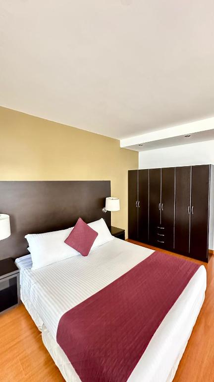 Postel nebo postele na pokoji v ubytování Hotel Juliette Bogota