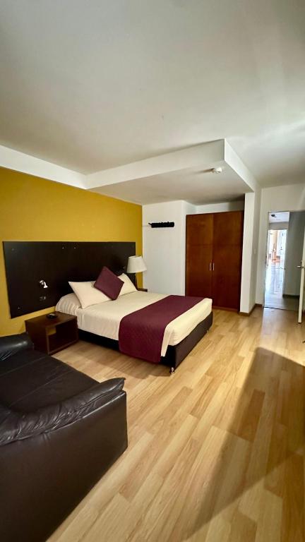 Postel nebo postele na pokoji v ubytování Hotel Juliette Bogota