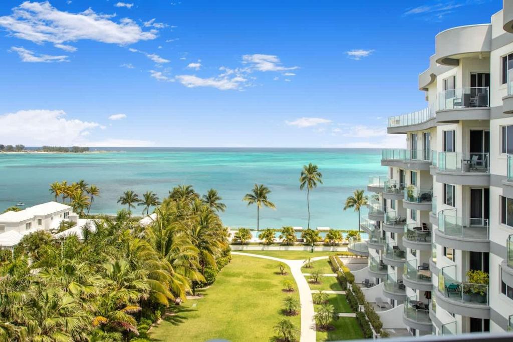 an aerial view of a building with the ocean in the background at 4 Bedroom Cable Beach Condo with Balcony in Nassau