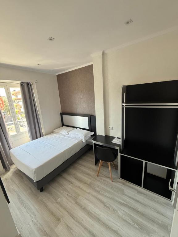 Postel nebo postele na pokoji v ubytování Hotel Laura