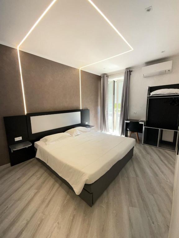 Postel nebo postele na pokoji v ubytování Hotel Laura