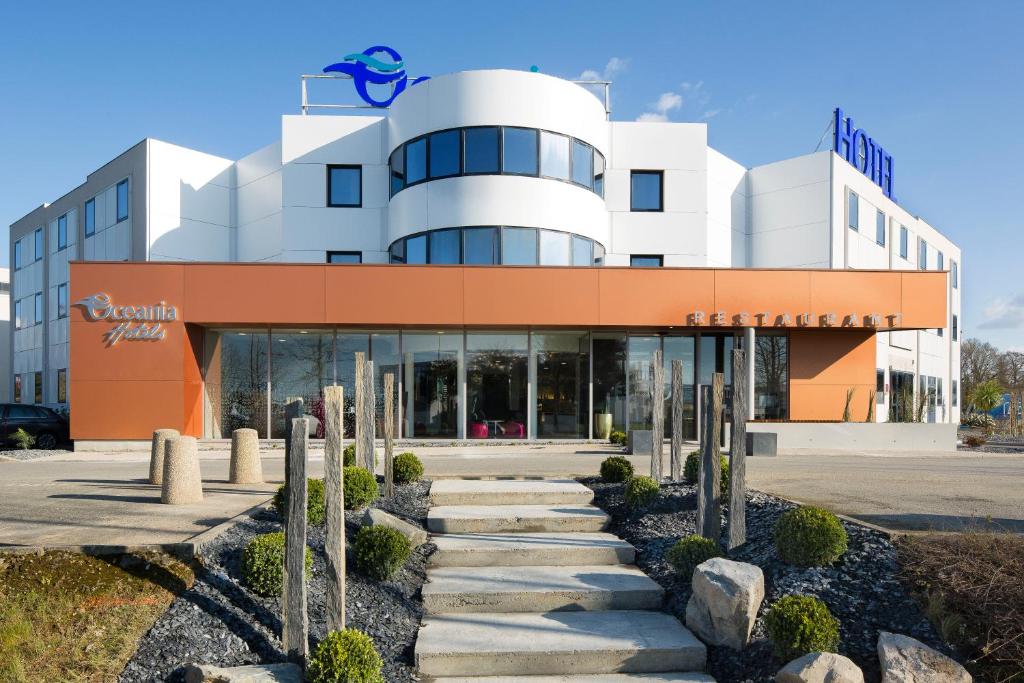 a building with a staircase in front of it at Oceania Rennes in Saint-Grégoire