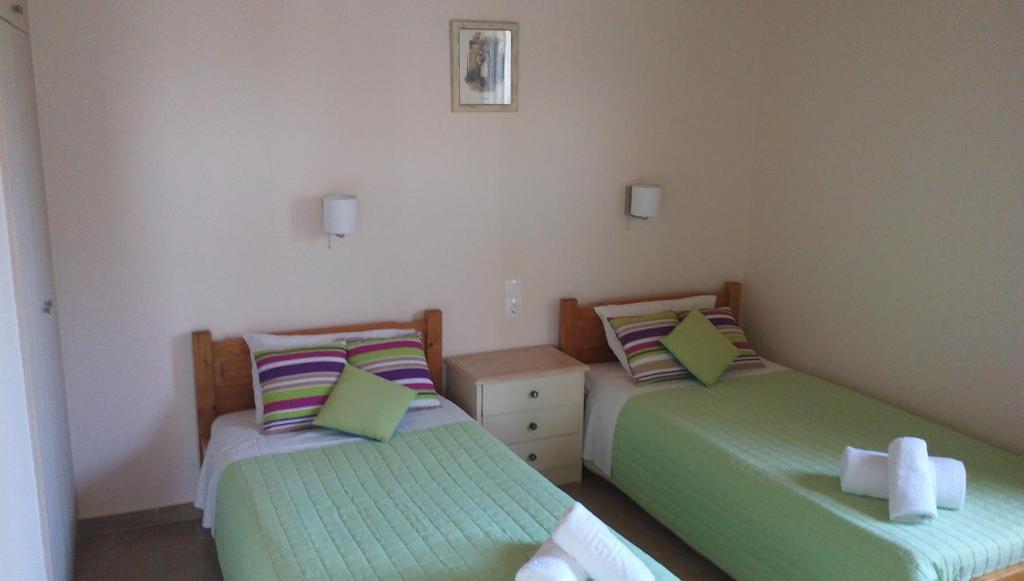 Postel nebo postele na pokoji v ubytování Gorgona apartments & studios