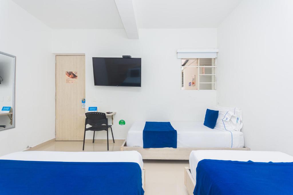 TV a/nebo společenská místnost v ubytování Hotel Suite del Parque