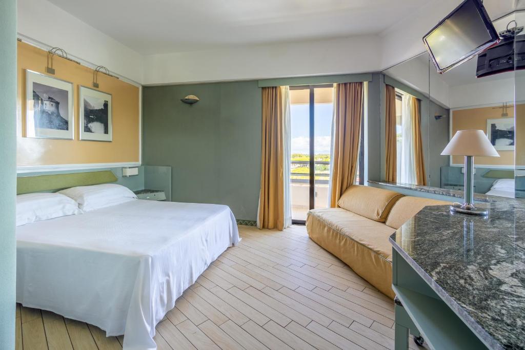 Postel nebo postele na pokoji v ubytování Circeo Park Hotel