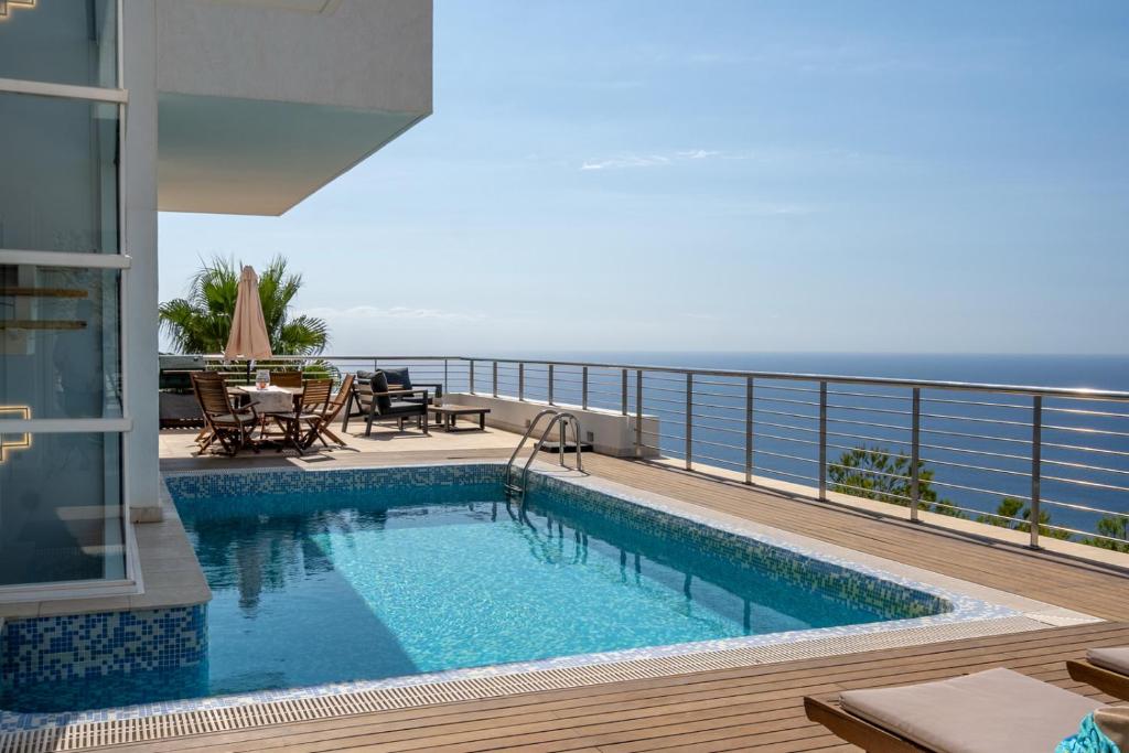 a swimming pool on the balcony of a house at Luxury Villa in Altea Hills in Altea