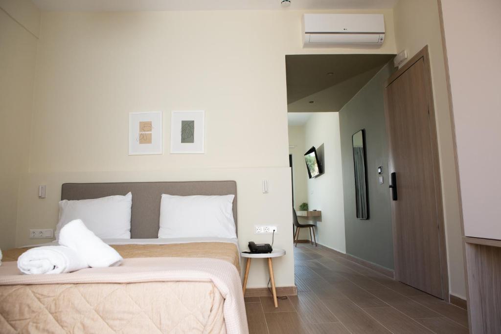 Postel nebo postele na pokoji v ubytování Trinasus Hotel