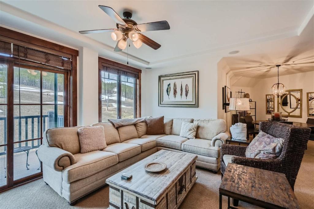 a living room with a couch and a table at Best Mtn View-Ski In Ski Out & Gondola to Downtown in Breckenridge