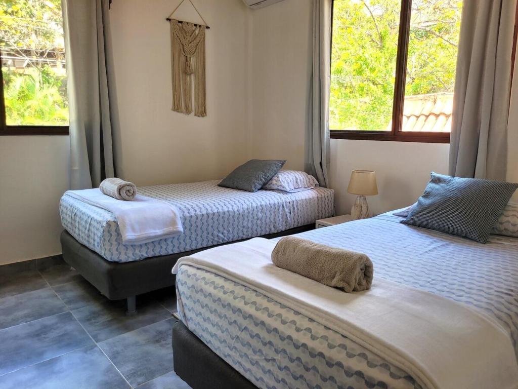 Postel nebo postele na pokoji v ubytování Casa Blanca Cambutal