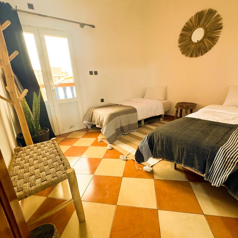 Postel nebo postele na pokoji v ubytování Olas Surf Camp