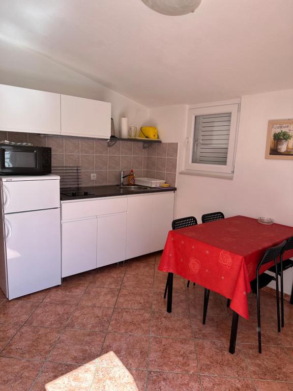Kuchyň nebo kuchyňský kout v ubytování Apartmani Šehović