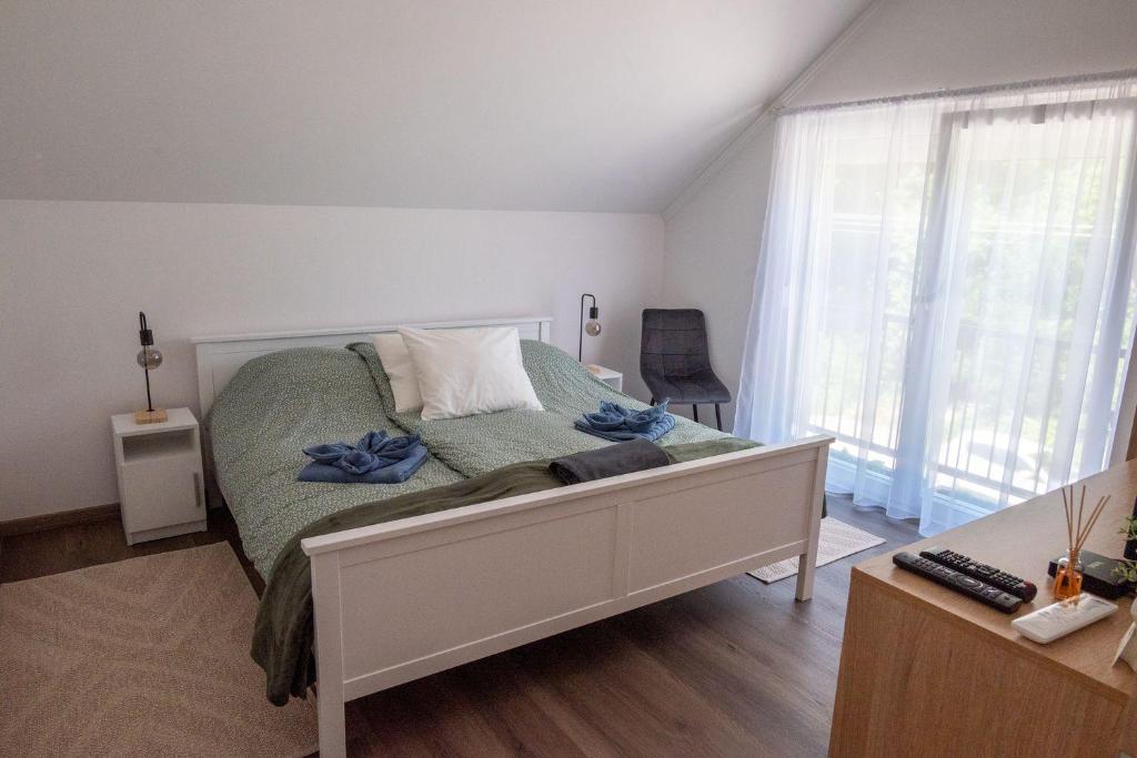 Postel nebo postele na pokoji v ubytování Pipi és Papi vendégház