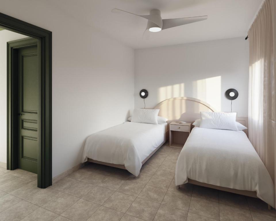 A bed or beds in a room at Apartamentos Princesa Guayadeque
