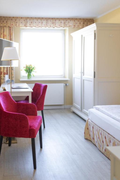 Postel nebo postele na pokoji v ubytování Hotel Dünenburg