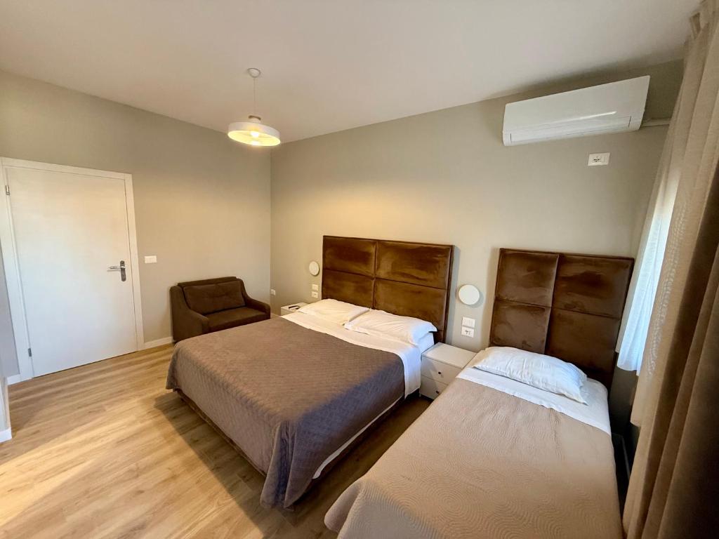 Voodi või voodid majutusasutuse Rooms Dionis toas