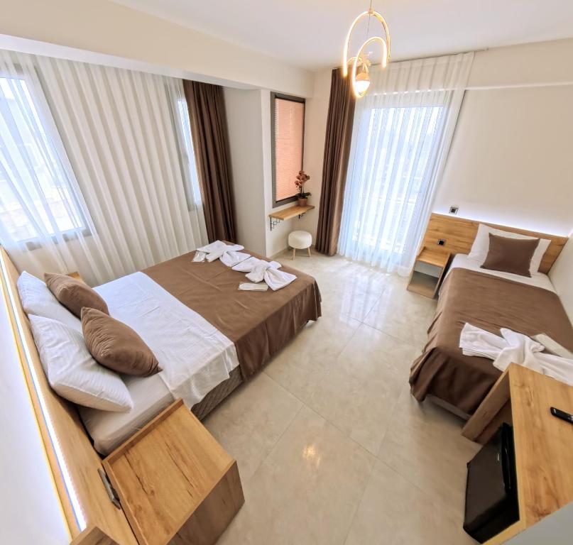 Postel nebo postele na pokoji v ubytování Naturalis Pamukkale Otel
