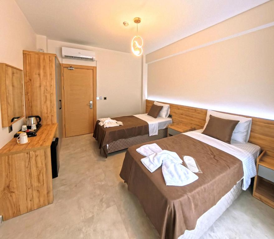 Postel nebo postele na pokoji v ubytování Naturalis Pamukkale Otel