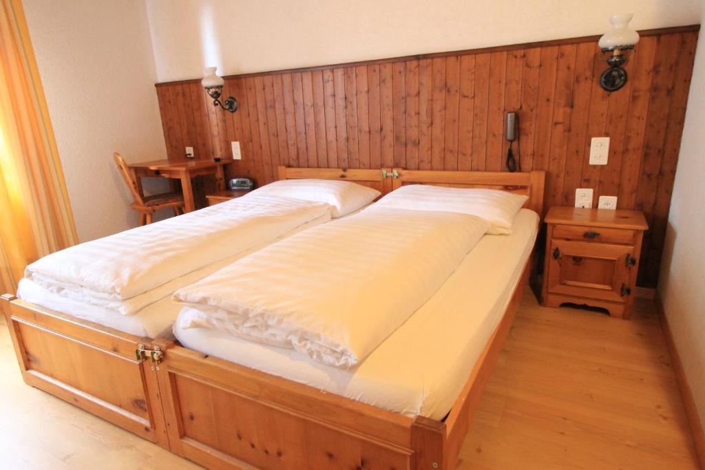 Postel nebo postele na pokoji v ubytování Hotel Fiescherhof