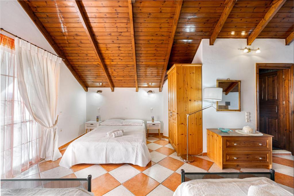 Posteľ alebo postele v izbe v ubytovaní Rosa Seaview Loft
