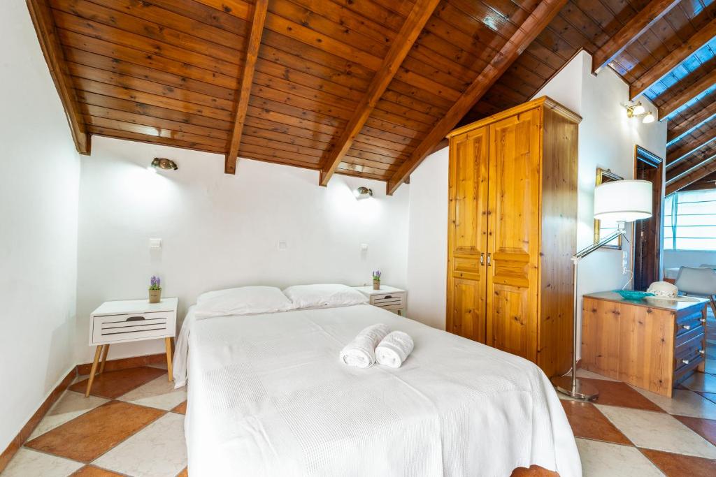 Posteľ alebo postele v izbe v ubytovaní Rosa Seaview Loft