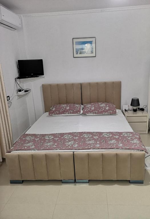 Uma cama ou camas num quarto em Guest House Emi