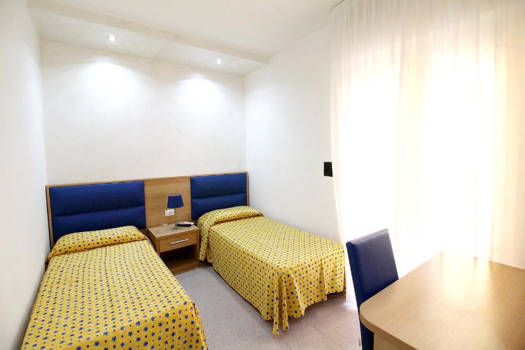 Postel nebo postele na pokoji v ubytování Hotel Eraclea