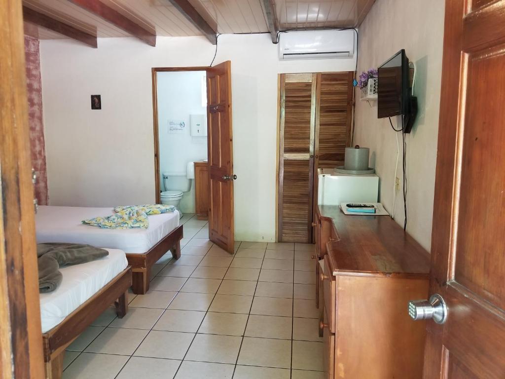 Postel nebo postele na pokoji v ubytování Mapi's Cabins