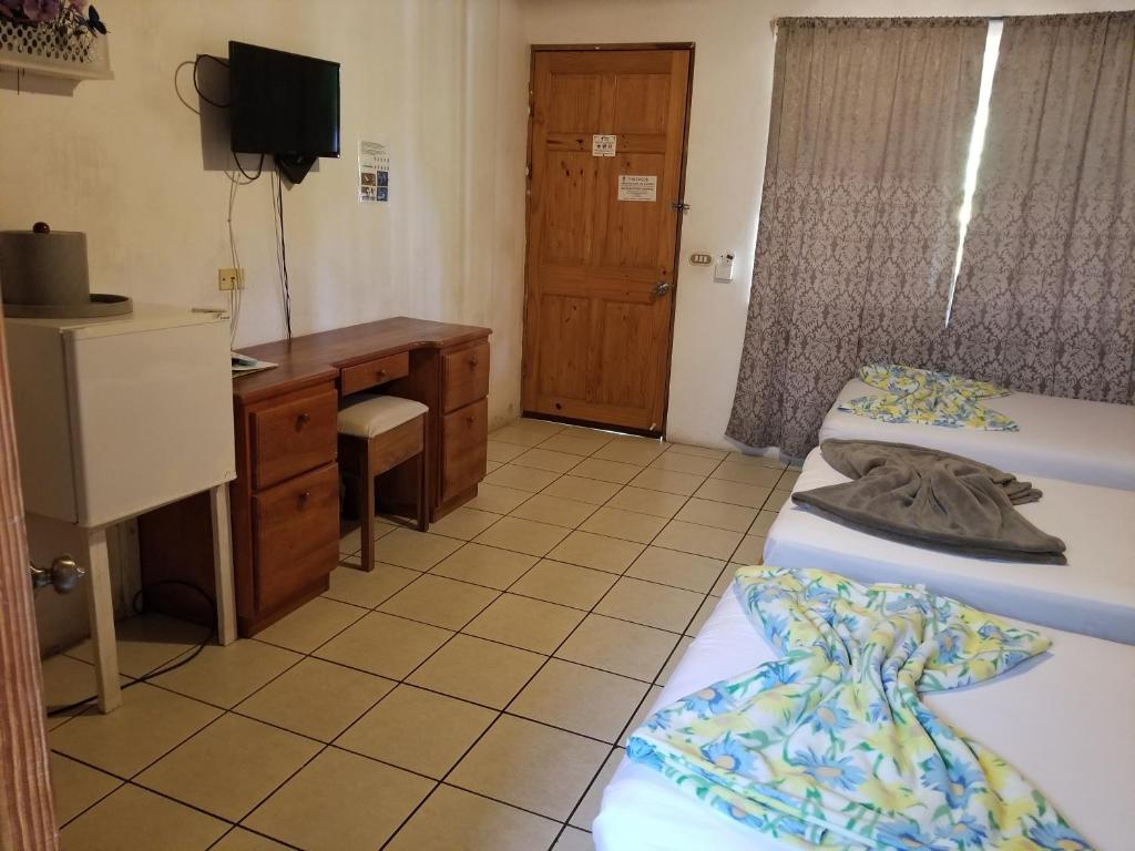 Postel nebo postele na pokoji v ubytování Mapi's Cabins
