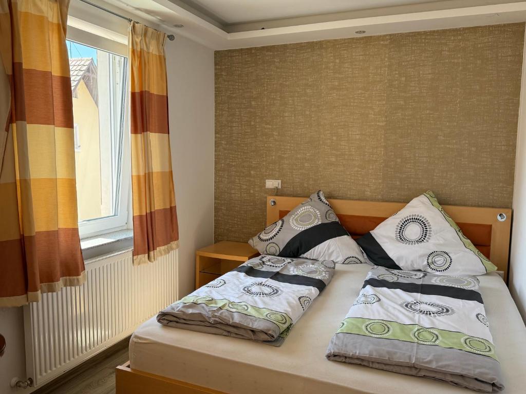 a bedroom with two beds and a window at CoBa in Baden-Baden