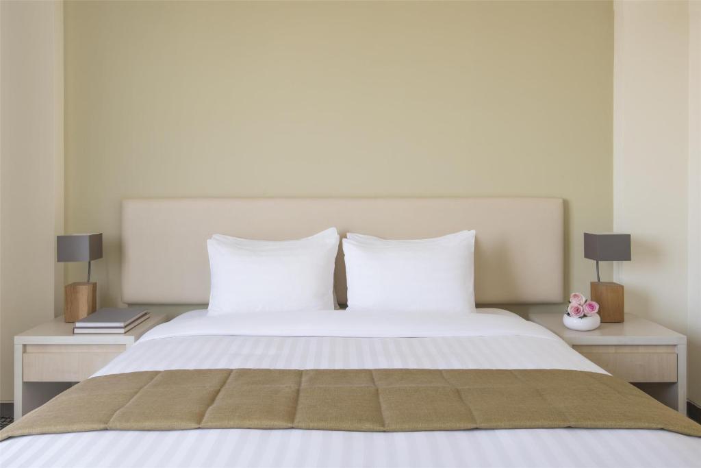 Postel nebo postele na pokoji v ubytování Bristoria Hotel Erbil