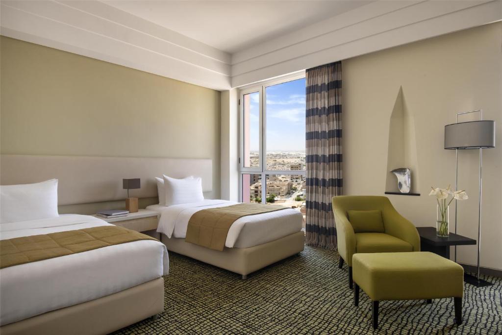 Postel nebo postele na pokoji v ubytování Bristoria Hotel Erbil