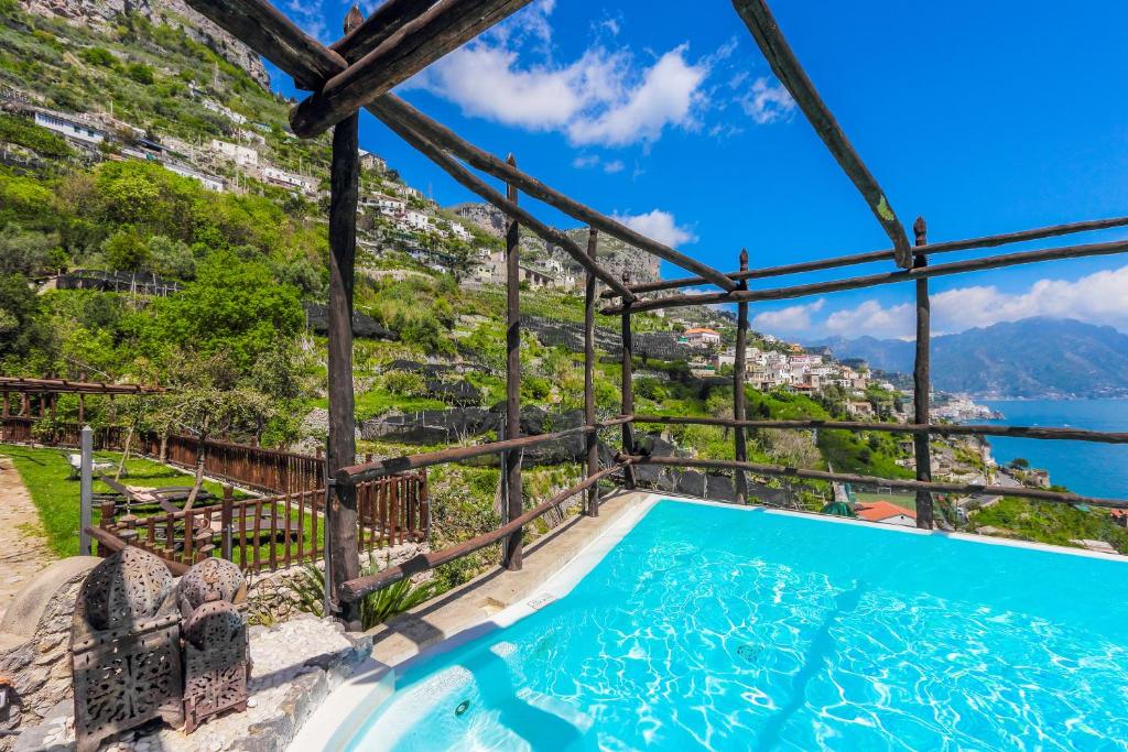 a villa with a swimming pool and a view at Villa Alba d'Oro in Amalfi