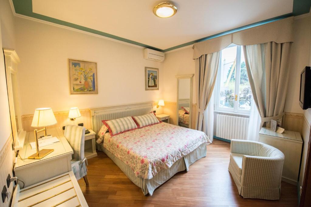 Postel nebo postele na pokoji v ubytování Hotel Posta