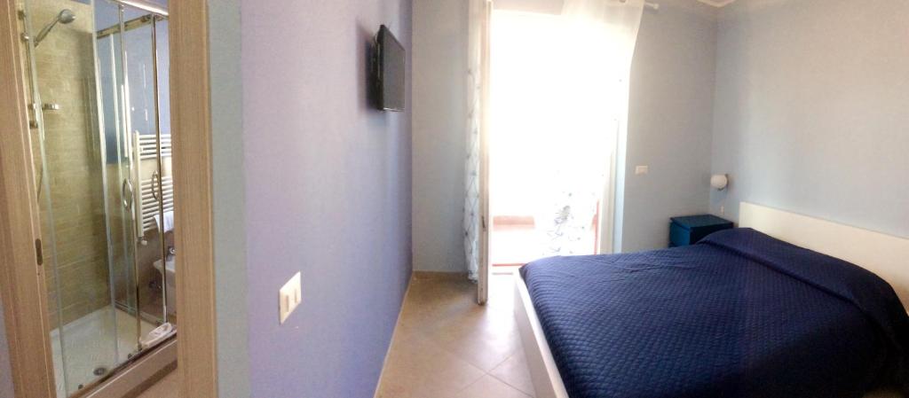 Postel nebo postele na pokoji v ubytování Guest House Roma Express