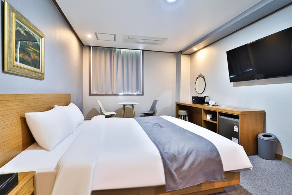 Postel nebo postele na pokoji v ubytování Hotel Noah