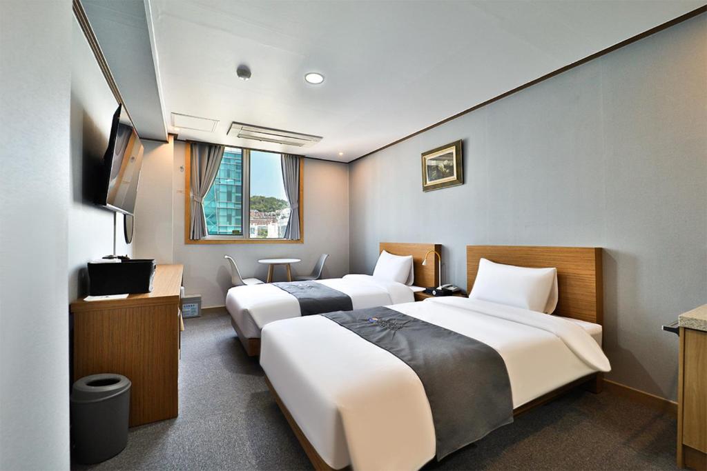 Postel nebo postele na pokoji v ubytování Hotel Noah