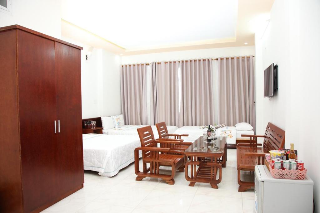 Postel nebo postele na pokoji v ubytování An Bình Tài Hotel
