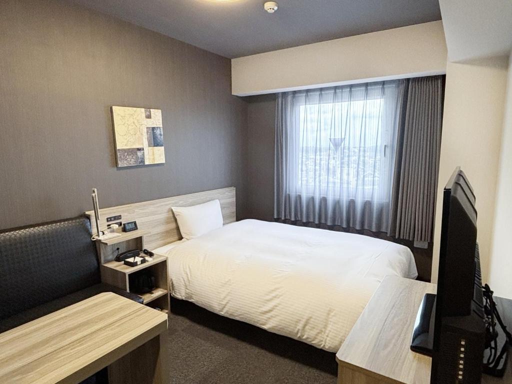 TV a/nebo společenská místnost v ubytování Hotel Route Inn Noda -Kokudo 16 Gouzoi-