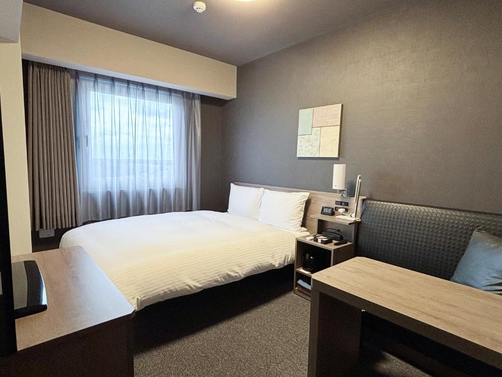 Postel nebo postele na pokoji v ubytování Hotel Route Inn Noda -Kokudo 16 Gouzoi-