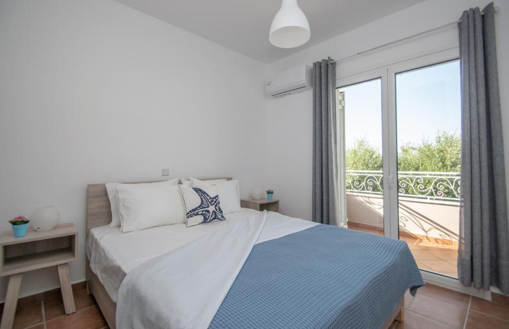 Postel nebo postele na pokoji v ubytování Villa Zoi