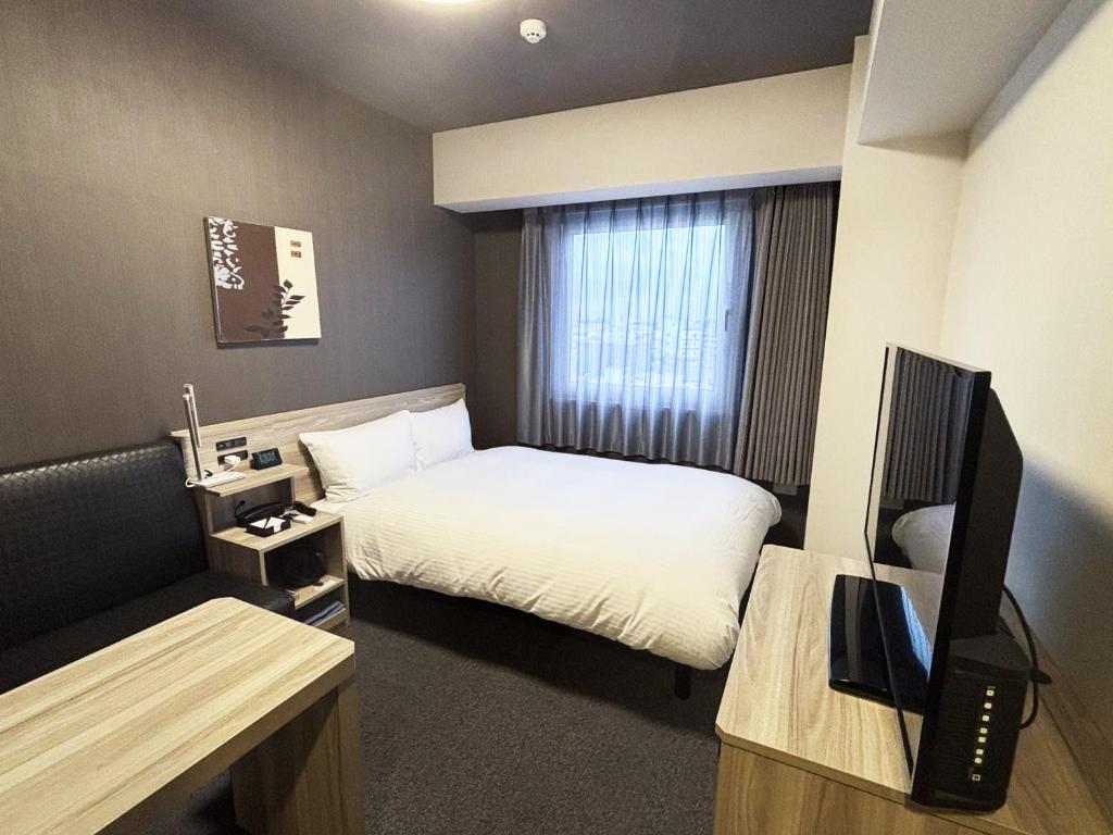 TV a/nebo společenská místnost v ubytování Hotel Route Inn Noda -Kokudo 16 Gouzoi-