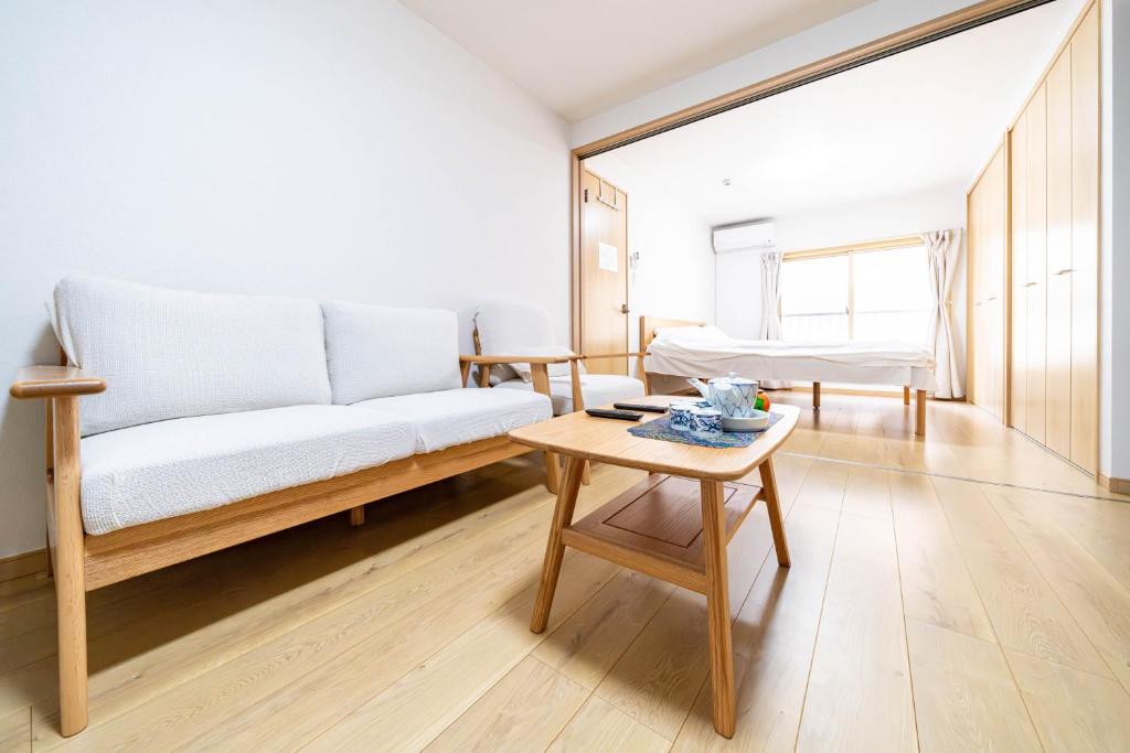 Ένα ή περισσότερα κρεβάτια σε δωμάτιο στο Torikari 5-chome1-10 鳥飼5丁目1-10