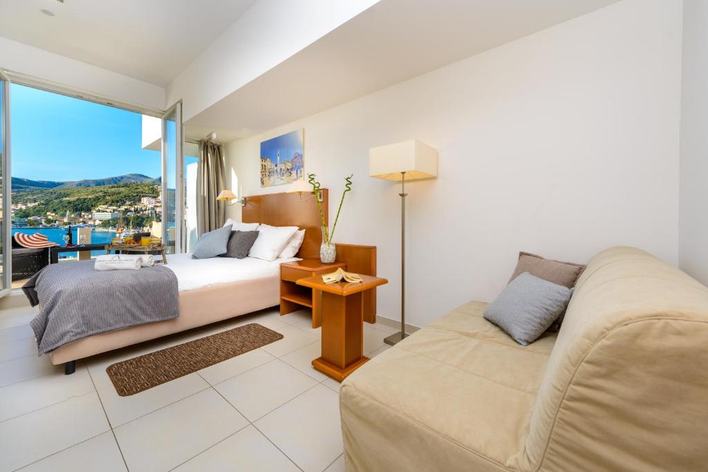 Postel nebo postele na pokoji v ubytování Adriatic Deluxe Apartments