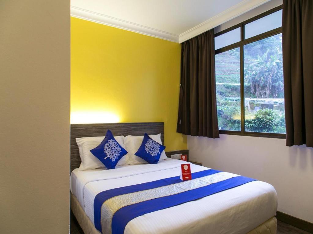 Postel nebo postele na pokoji v ubytování OYO 229 Parkland Hotel