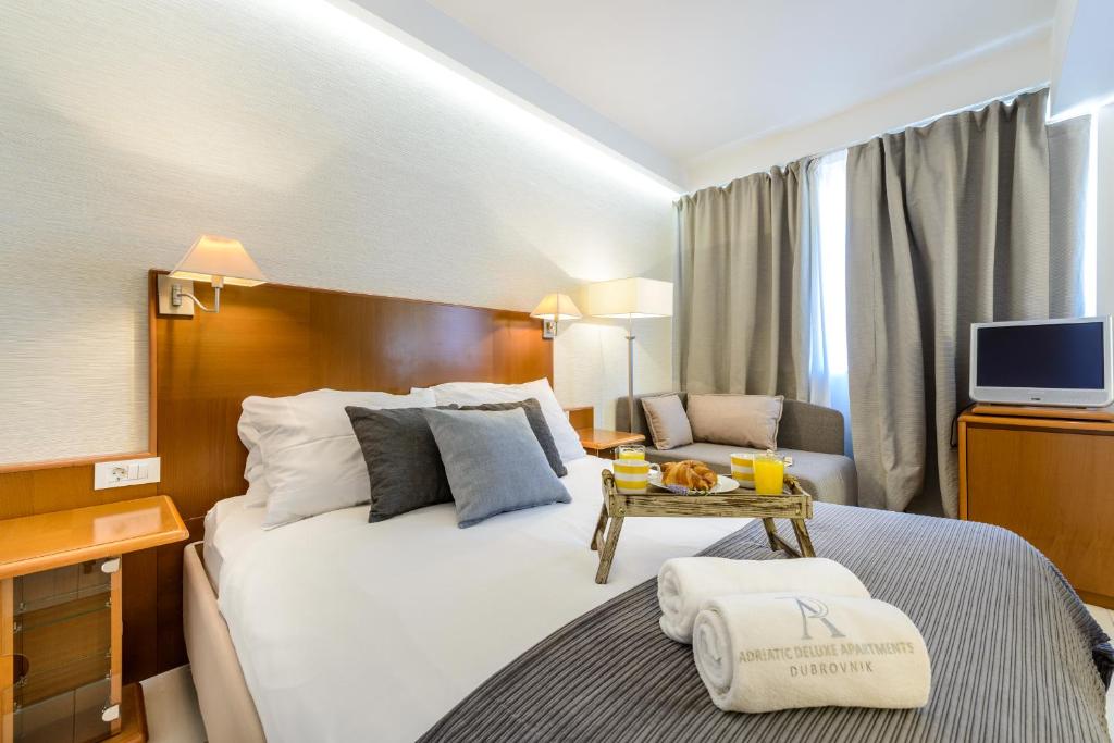 Postel nebo postele na pokoji v ubytování Adriatic Deluxe Apartments