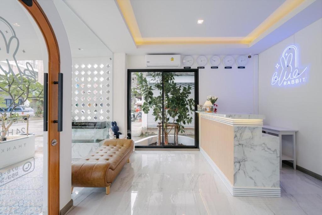 a store with a bench in the middle of a room at Blue rabbit phuket in Ban Tha Khreng