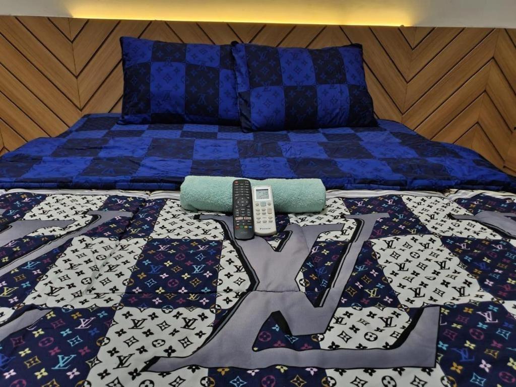 Postel nebo postele na pokoji v ubytování Capital O 93594 Pelangi Urbano