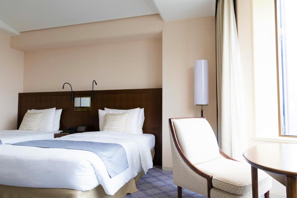 Postel nebo postele na pokoji v ubytování Imperial Hotel Tokyo