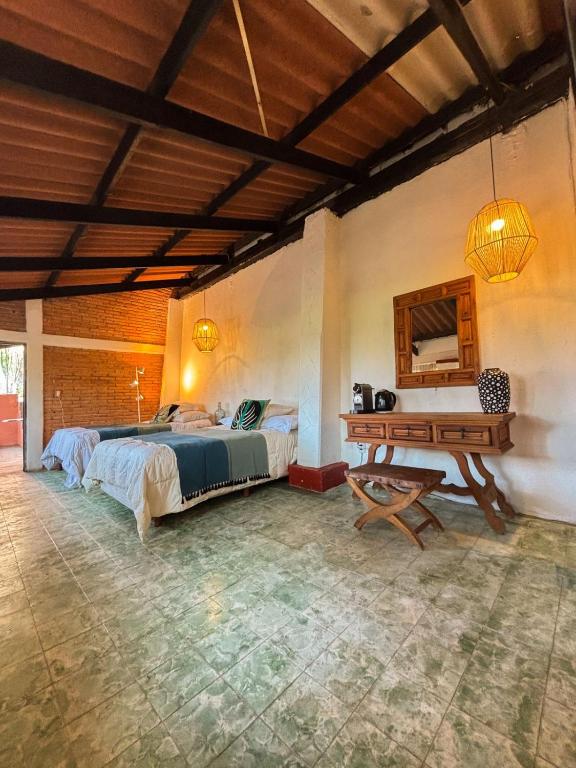 Ένα ή περισσότερα κρεβάτια σε δωμάτιο στο Refugio de Montaña en Hidalgo Tropical desde 1869